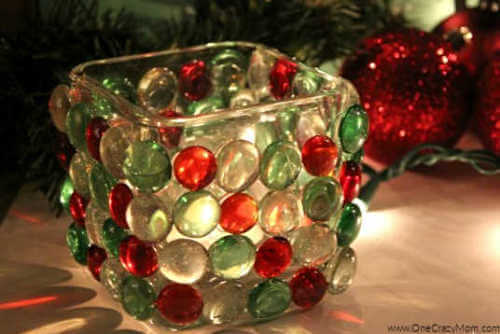 Looking to jazz up your holiday decor on a budget? Try this DIY Dollar Store Christmas Candle Holder that takes only minutes to make and is frugal and easy. 