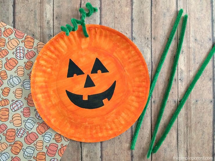 Paper plate painted as jack o lantern. 