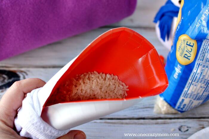 Funnel with rice in a sock. 
