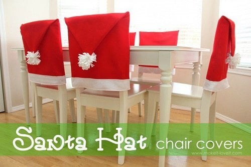 Santa Hat chair covers on a white table. 