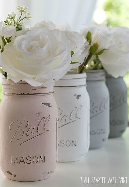 Mason jars distressed with flowers. 