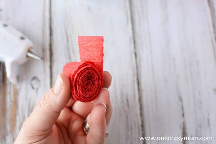 Rolling crepe paper.