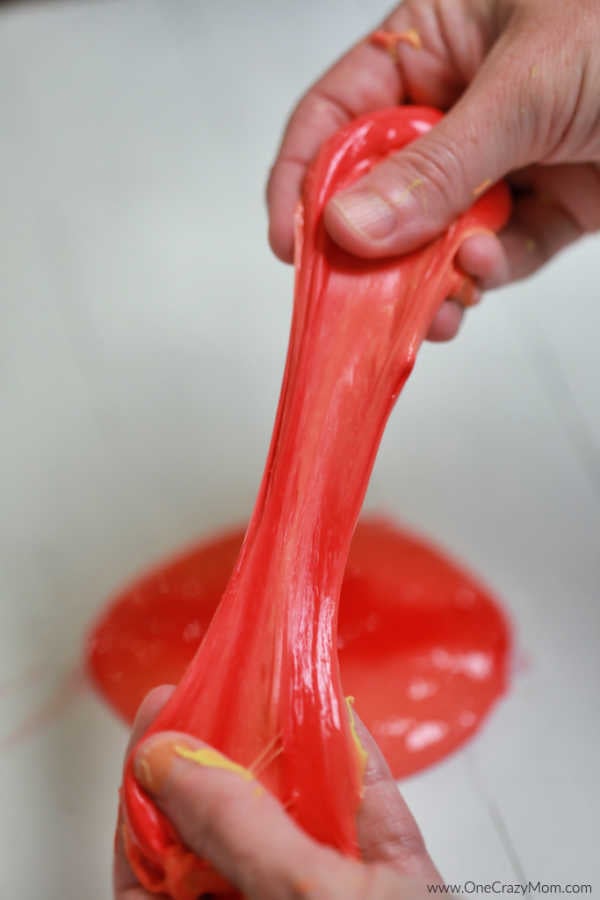 Color changing slime in a hand.