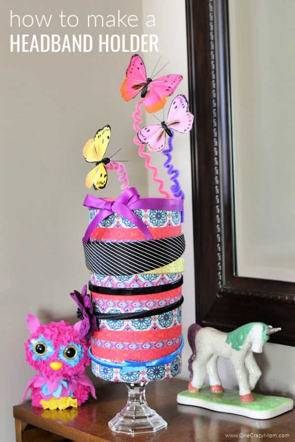 DIY headband holder with headbands sitting on a dresser. 