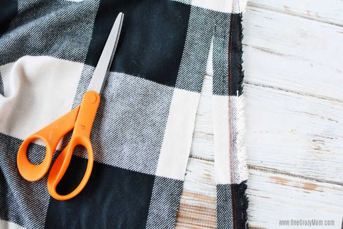 Learn how to make a blanket scarf and see how simple and easy it is. No need to buy these scarves at the store when you can make a no sew scarf at home.