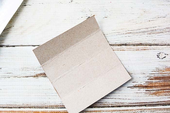 Cardboard being folded. 