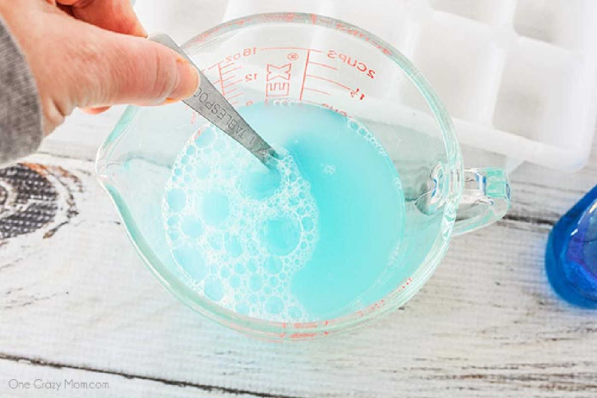 Combining the garbage disposal ingredients together in a measuring cup