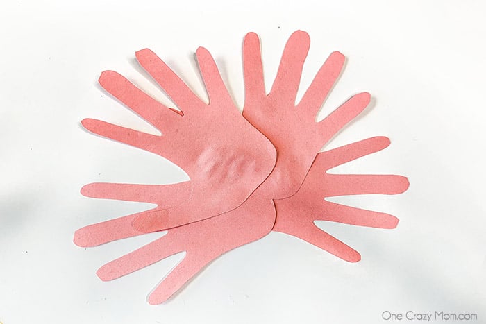 Handprint Flowers are perfect to make for Mother's Day, birthdays and more. This gift will be cherished for years to come by Mom, Grandma and others.