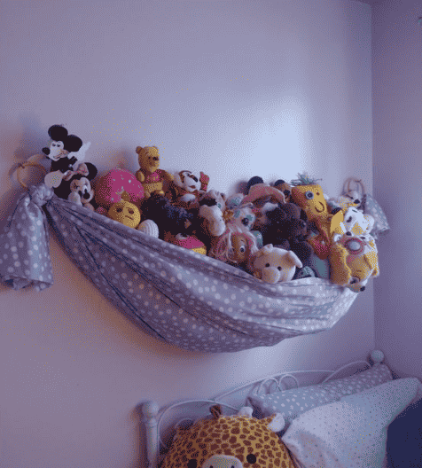 Hammock from fabric on the wall. 