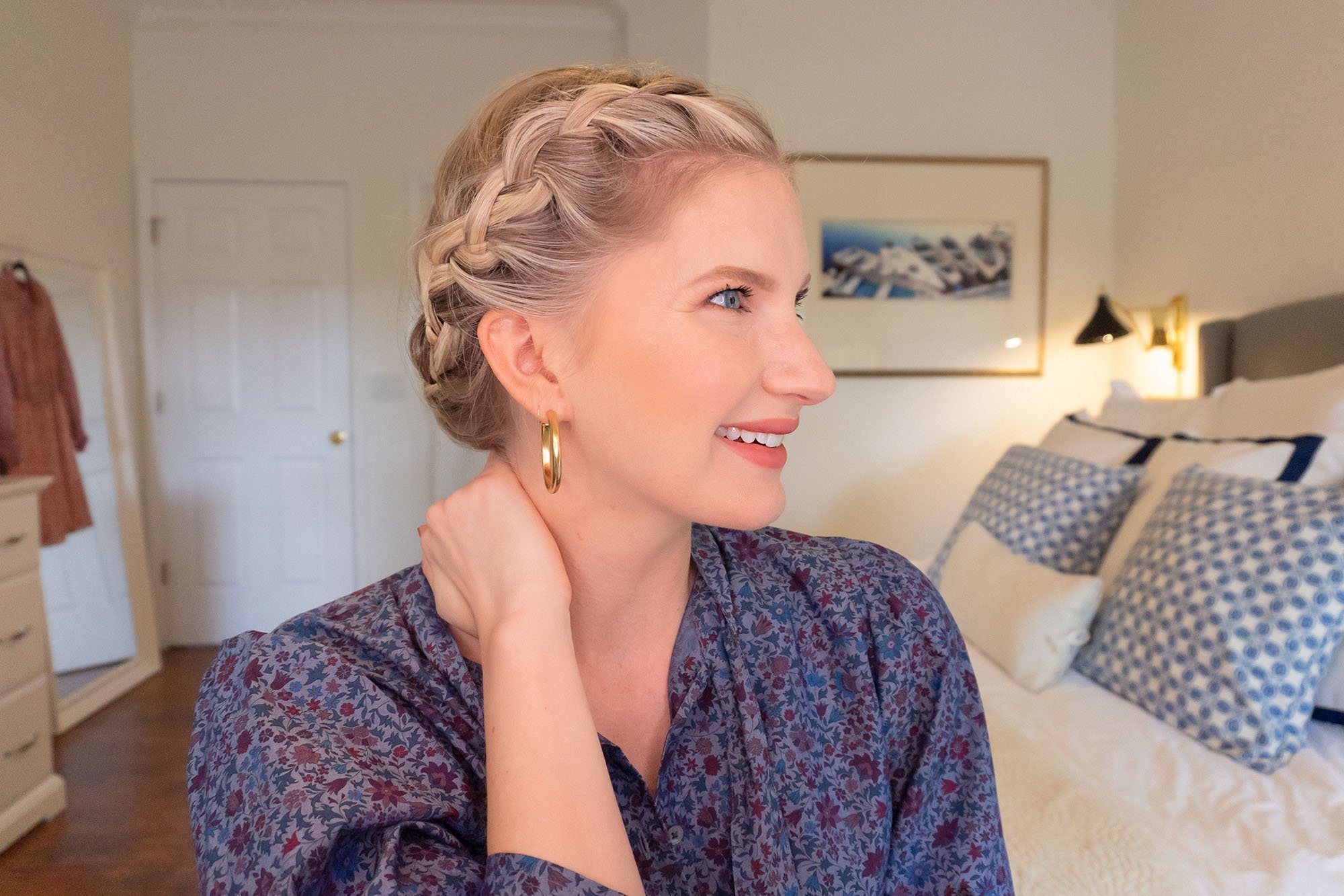 Crown Braid on lady sitting by bed. 
