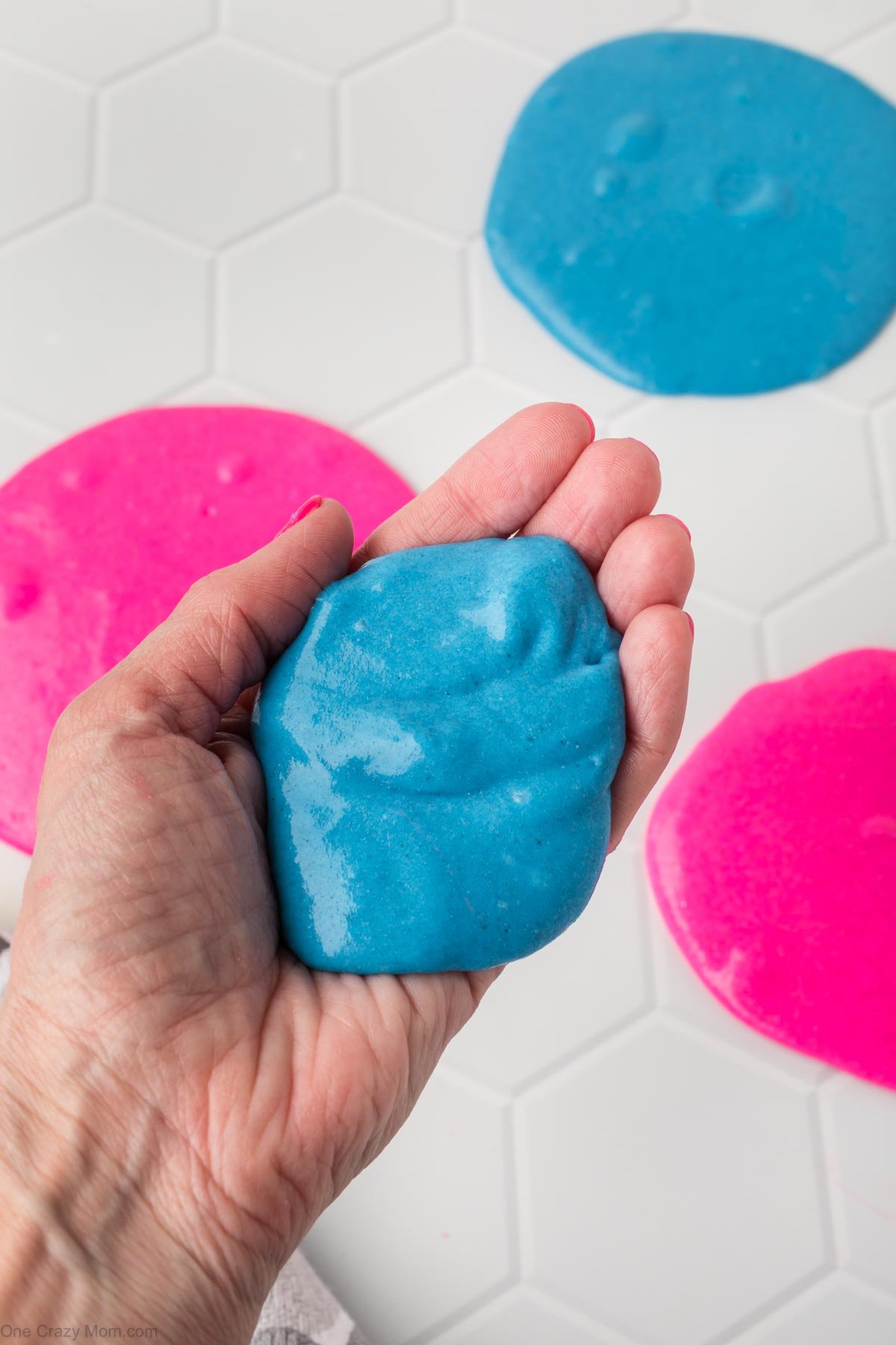 Kinetic Sand Slime in hands ready to play with.
