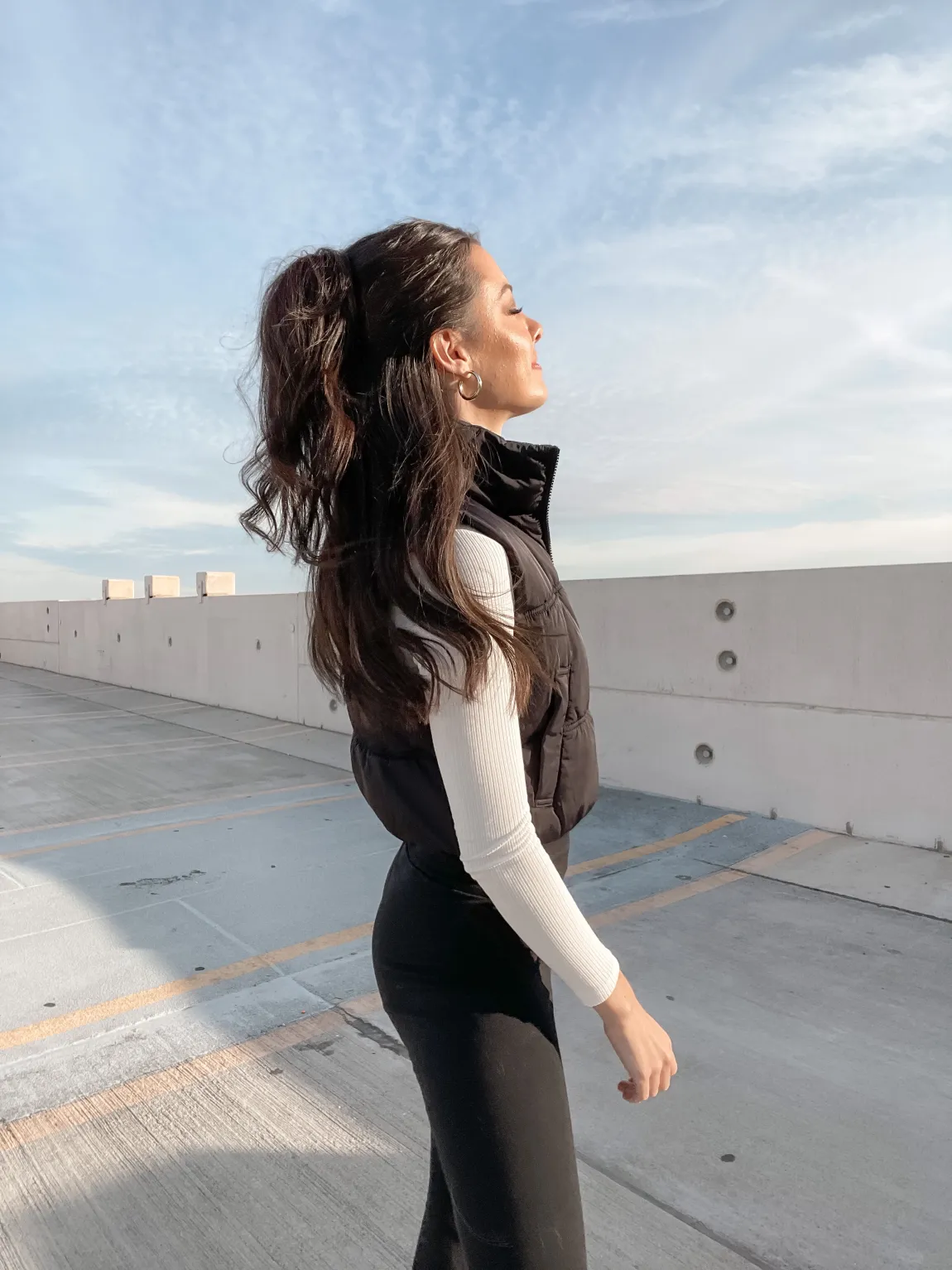 Updo on lady with dark hair.